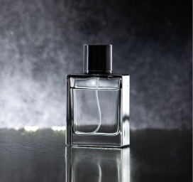Midnight Spice perfume bottle with black cap and gold label on a dark background